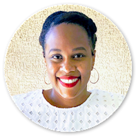 Headshot of Monica Lewis wearing a white top, red lipstick, gold hoop earrings, and hair pinned back.